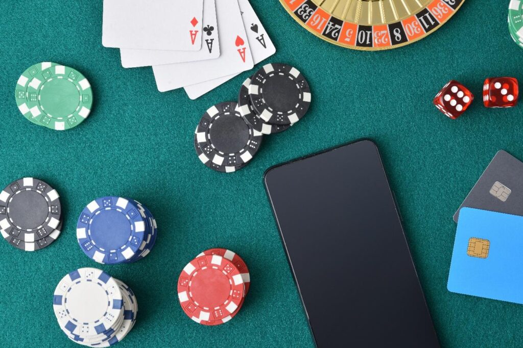 A poker table with chips and cardsAI-generated content may be incorrect.